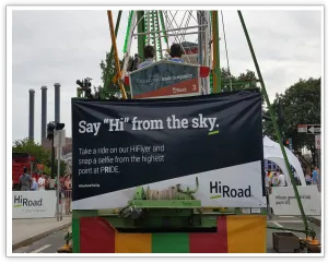 HiRoad Say Hi from the sky banner installed at the Ferris wheel entrance