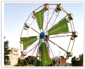 Westobou Ferris wheel with green pie-shaped sponsor panels